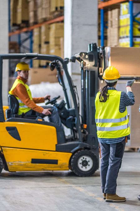 Mike Korger instructing a forklift operator